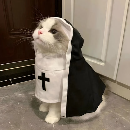 Black and white nun costume cloak for a small dog on a Halloween backdrop.