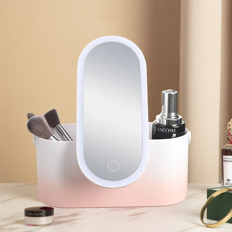 Pink gradient makeup storage box with LED mirror open, showing internal compartments and USB charging port.