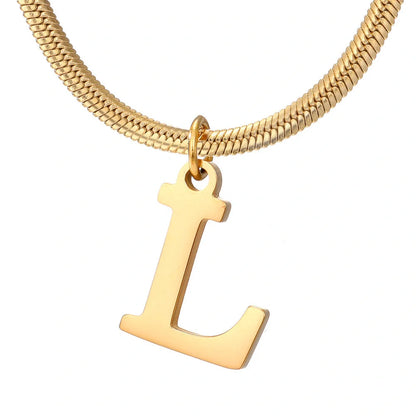 Elegant gold A-Z letter pendant necklace on a snake chain
