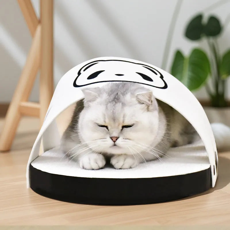 White slipper-style corrugated paper cat scratch board on a floor