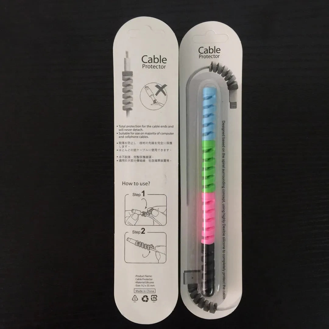 Plastic charging cable protector sleeve shown in various colours including black, blue, pink and yellow.