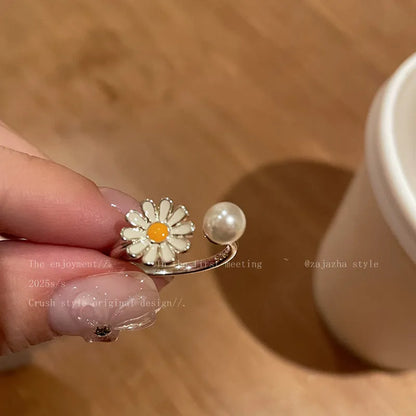Women's copper opening sweet twin ring set showing little daisy pearl and little daisy ring designs