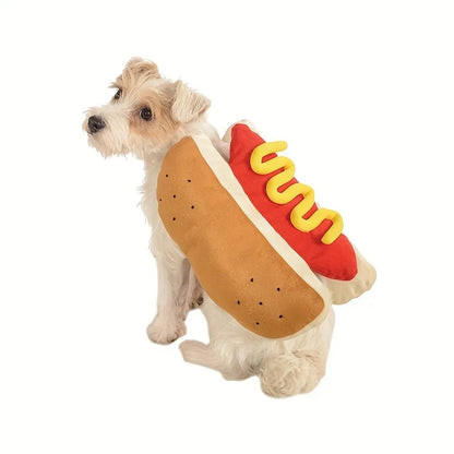 Small dog wearing a humorous stuffed hot dog costume suit in a winter setting.
