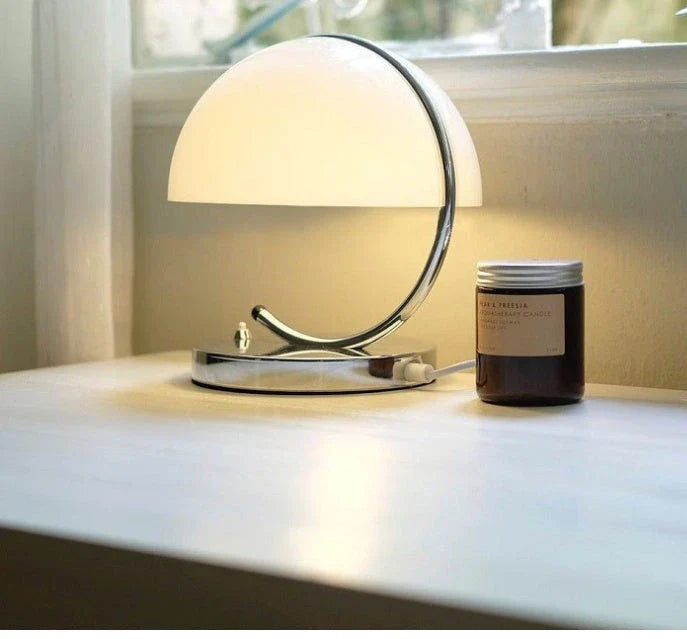 Retro-inspired table lamp with adjustable lighting modes, sleek minimalist design, and energy-efficient LED technology