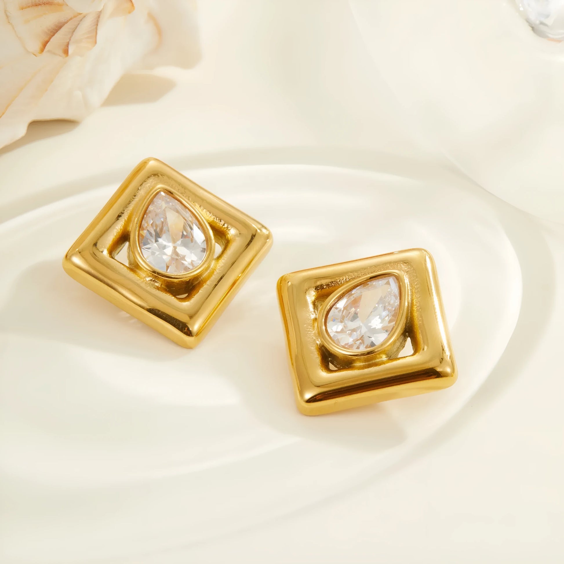 Gold geometric stud earrings with water drop zircon stones on stainless steel