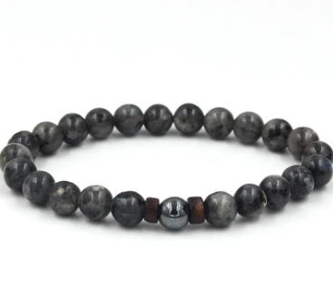 A stylish and durable men's bracelet made with volcanic stone, flash stone, and wood chips