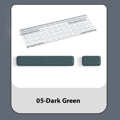 Double-sided black and grey keyboard mouse pad with wrist strap and hand pillow on a desk.