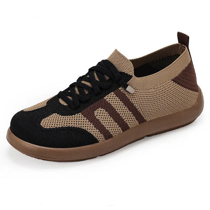 Retro style casual training shoes in flyknit mesh with a soft PU sole and flat heel.