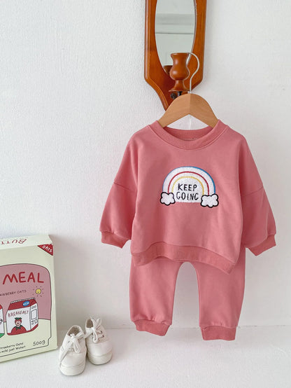 Children's cotton two-piece sweater set with pullover top and trousers in beige, emerald, or pink, sizes 66cm to 100cm.