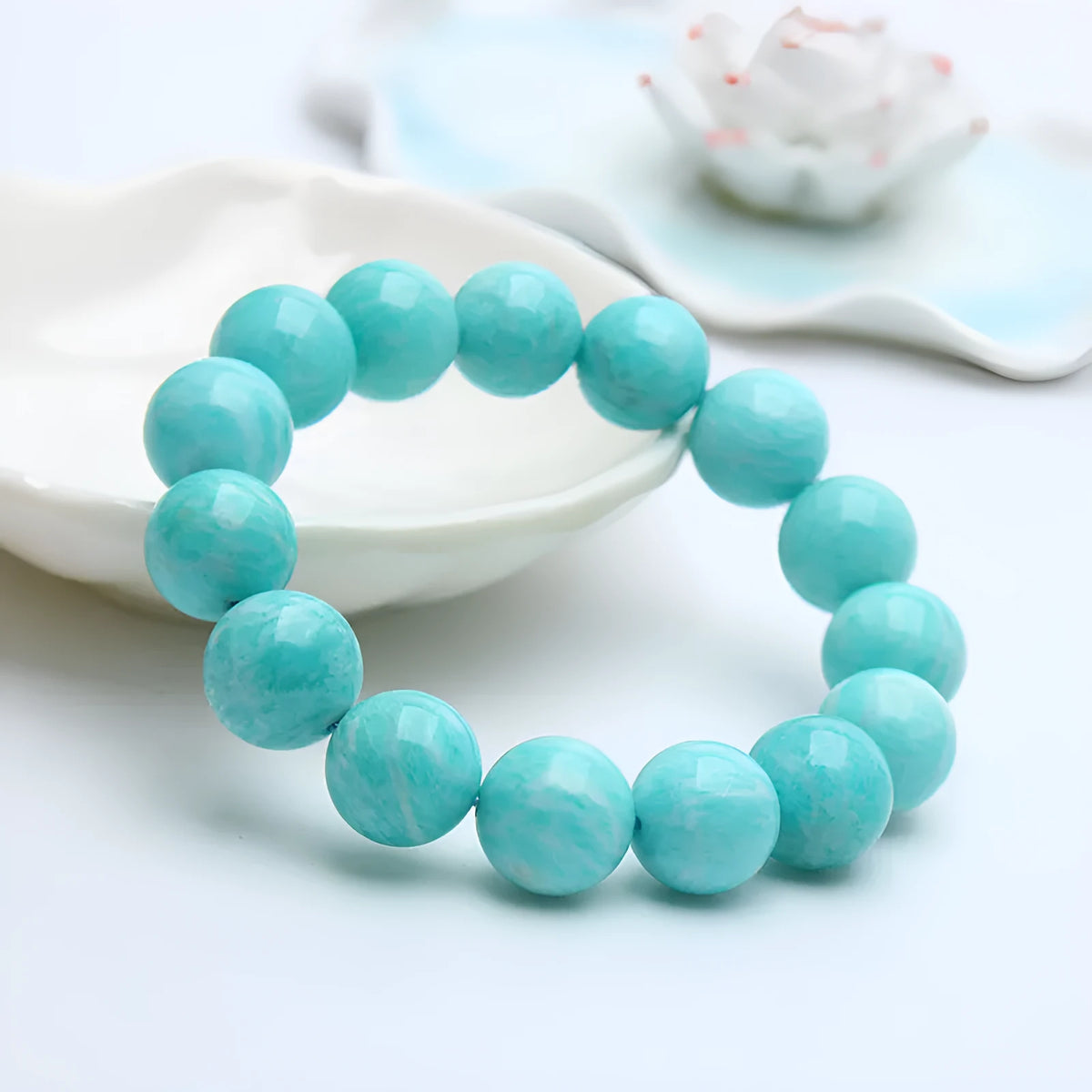 Amazonite gemstone bracelet with green-blue beads on a wrist