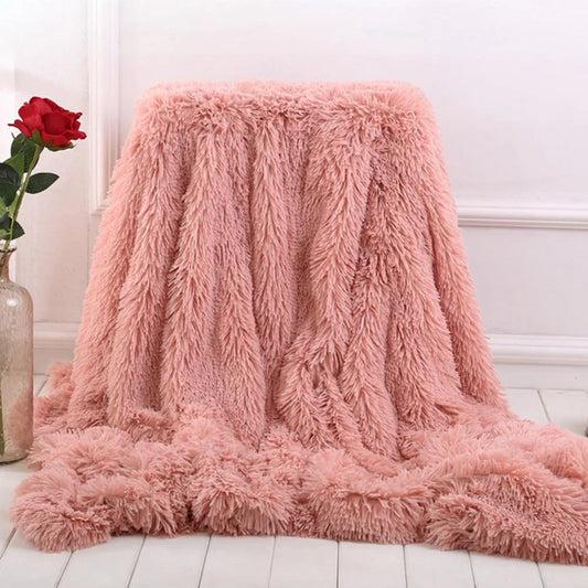 Soft coral fleece blanket in various colours and sizes for home and travel comfort