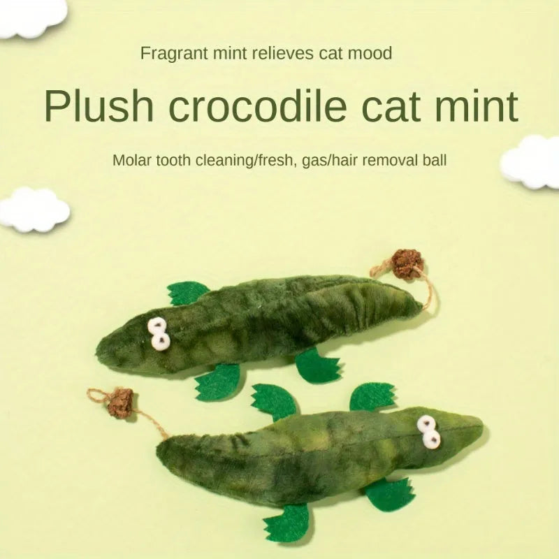 Green fabric plush alligator cat toy with catnip and peppermint scent for oral care.