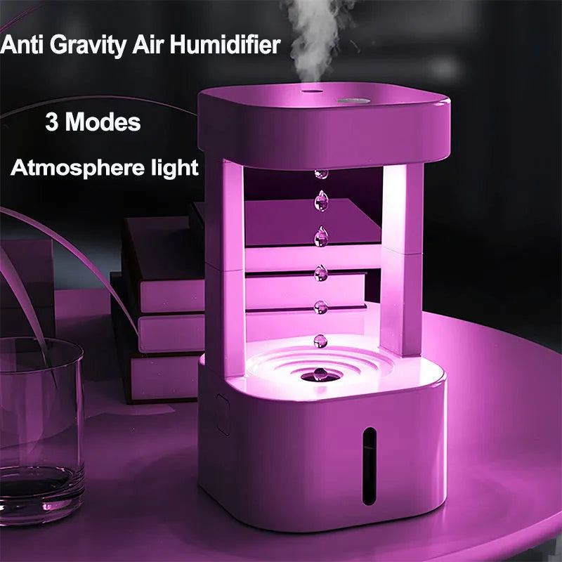 Anti-gravity water drop humidifier with 580ML water tank, quiet USB-powered mist spray for household bedroom office air quality, portable mini design with optical illusion water flow effect, ABS material construction, 10-12 hour operation.