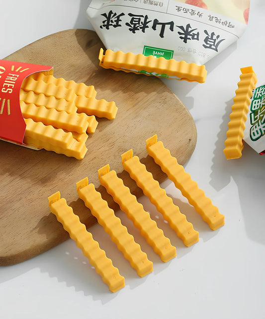 12-pack of white plastic food sealing clips, some with refrigerator stickers, for kitchen bag storage