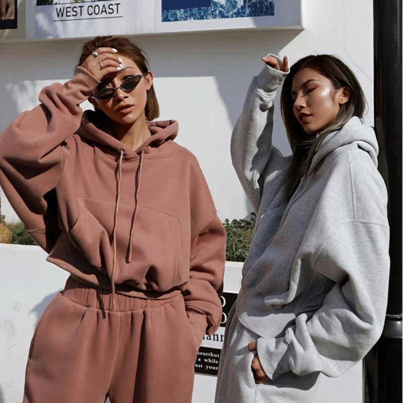 Women's polyester hoodie jacket and sports pants set in various colors for casual and athletic wear