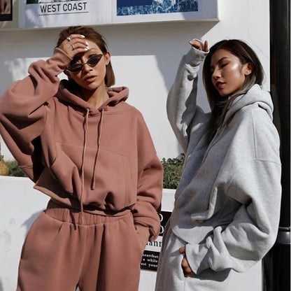 Women's polyester hoodie jacket and sports pants set in various colors for casual and athletic wear