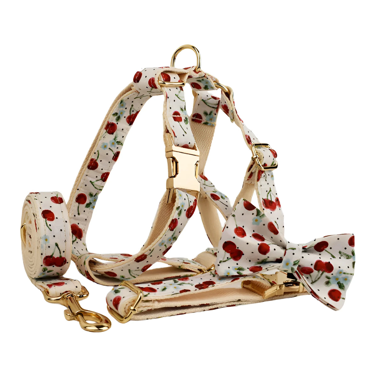 Red cherry printed dog collar with light gold buckle and matching leash, bow, vest and poop bag holder set