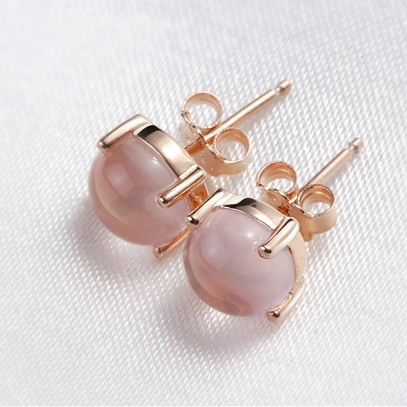 Women's simple Korean style drop shape stud earrings with synthetic ross quartz and rose gold finish.