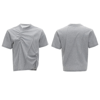 Men's loose fit black cotton T-shirt with textured pleats and asymmetric stitching detail.