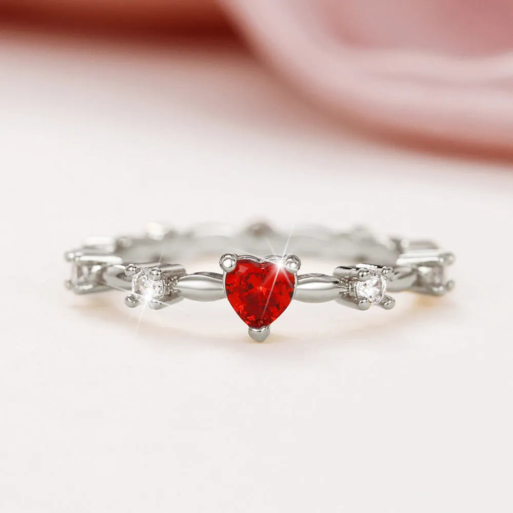 Gold and silver tone peach heart ring with zircon decoration, shown in sizes 6-10
