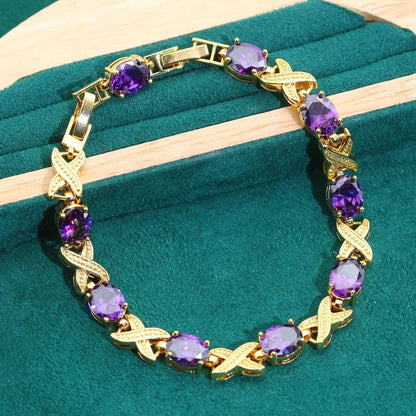 18k gold plated jewellery set with multi-colour zircon stones showing necklace, earrings, ring, and bracelet