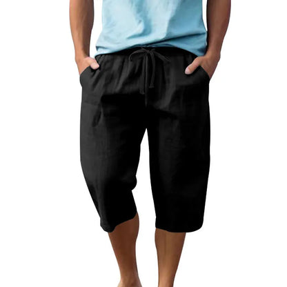 Men's loose-fit linen shorts in a solid colour with a drawstring waist and cropped leg length.