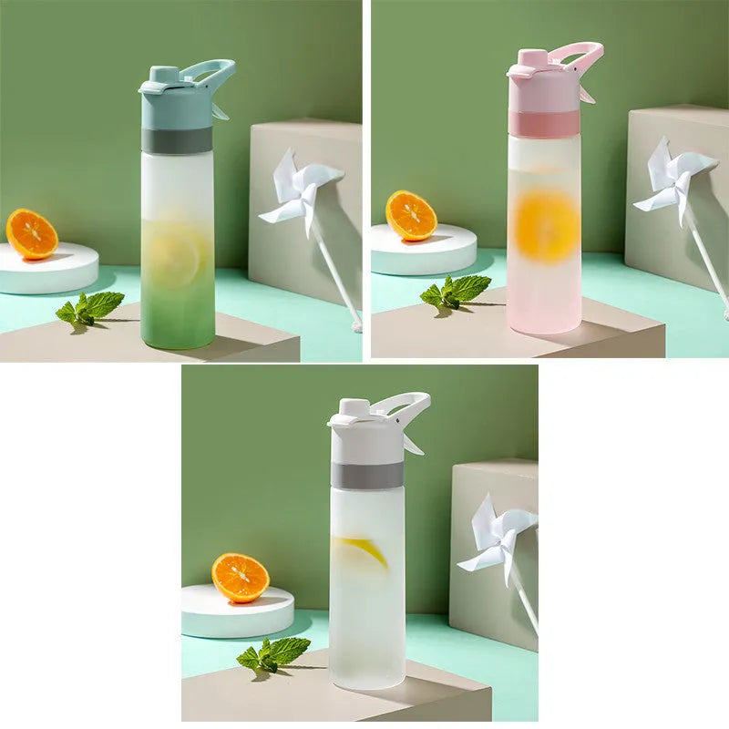 White spray water bottle with black leakproof lid and handle strap on a table