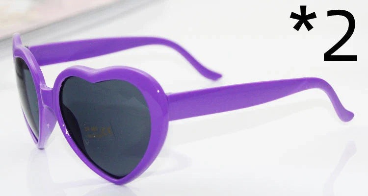 Fashionable heart-shaped light-up glasses with a built-in LED lighting system, perfect for adding a touch of love and playfulness to any occasion.