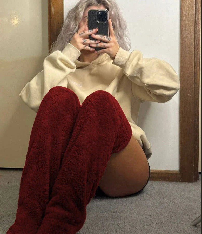 Cozy over-the-knee fuzzy socks in a variety of colors for winter warmth and comfort