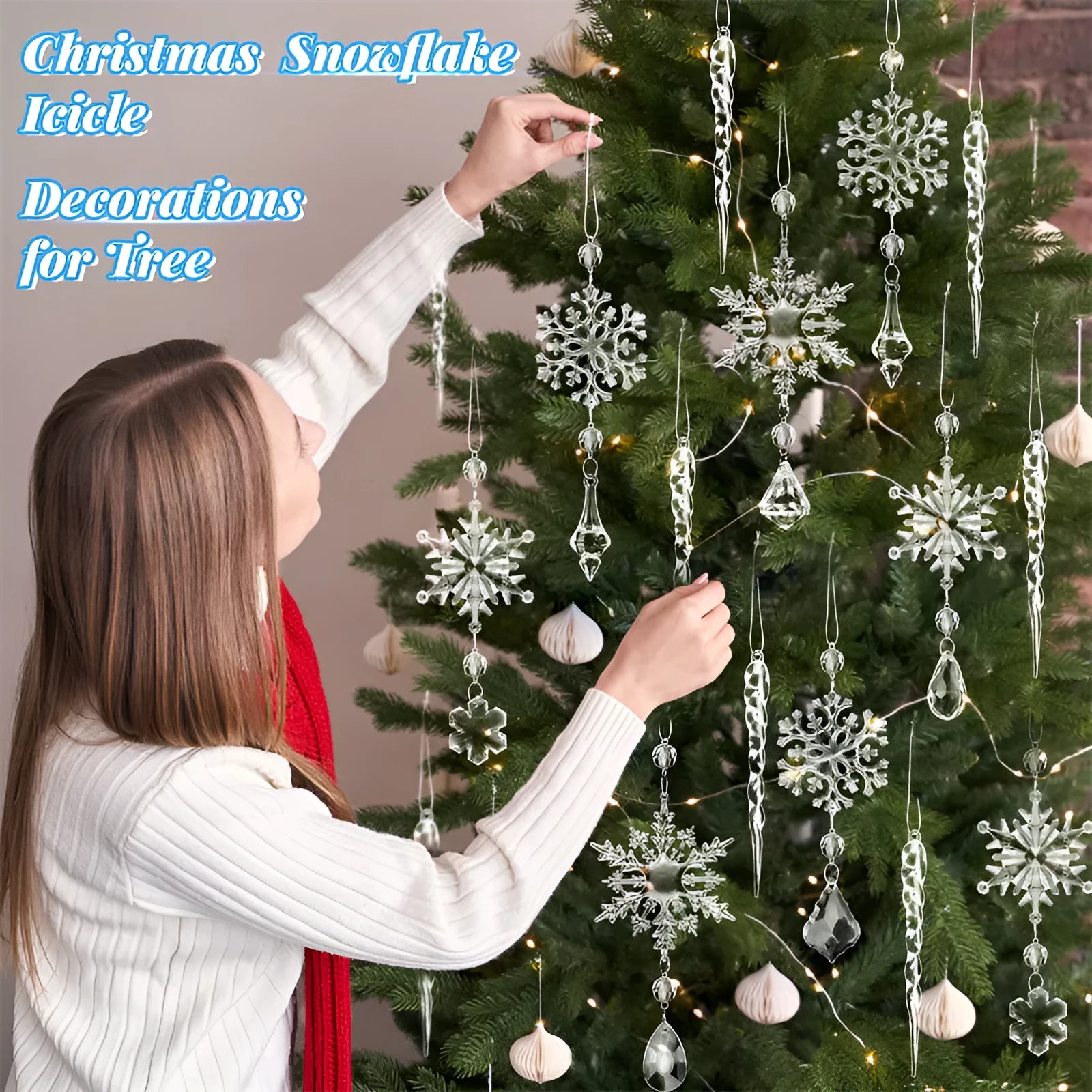 Ten clear acrylic icicle-shaped Christmas tree ornaments with white ribbon loops on a festive branch.