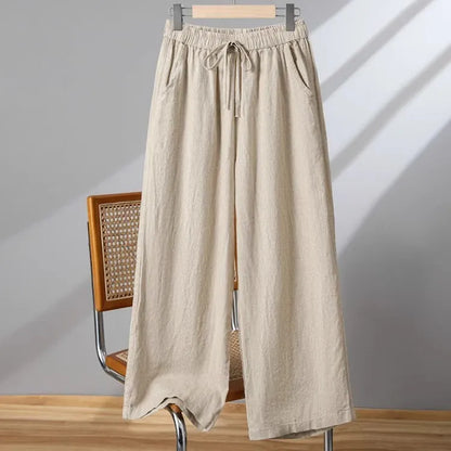 Women's apricot straight-leg casual trousers with elastic waist and drawstring lace-up detail.