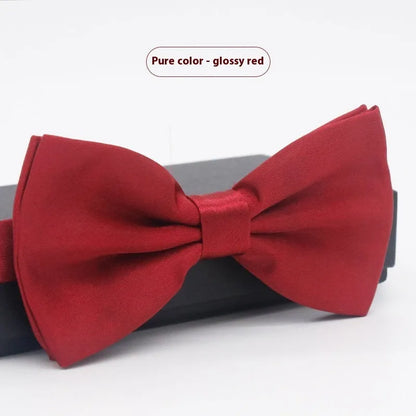 A solid colour pre-tied bow tie with an adjustable neck strap, shown in a classic flat head shape.