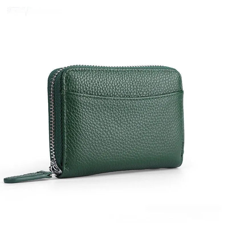 Genuine leather zipper coin purse in a solid colour showing sewing line detail.