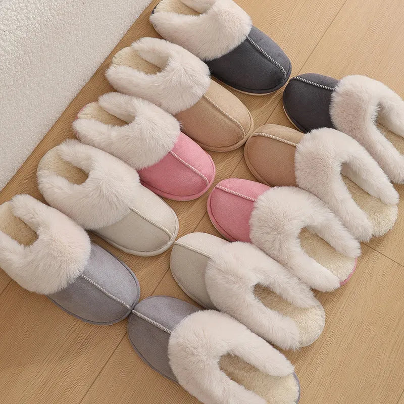 Women's plush winter slippers with round toe, flat heel, and stitching detail on a non-slip PVC sole.