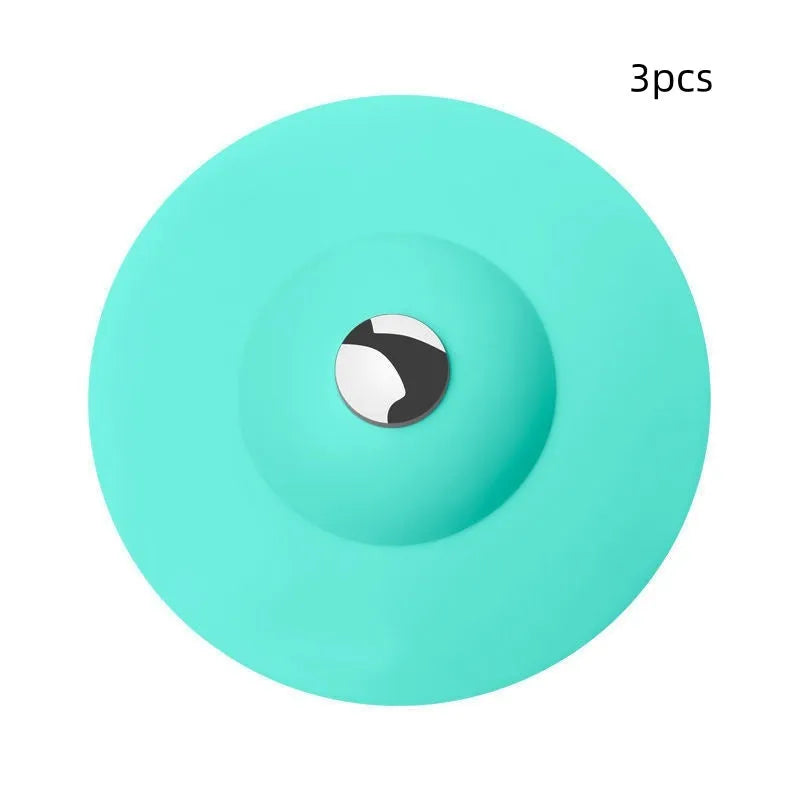 UFO-style silicone press sink drain cover in white, pink, gray, blue, and green