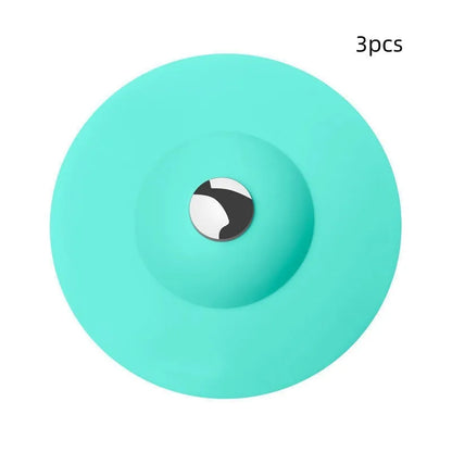 UFO-style silicone press sink drain cover in white, pink, gray, blue, and green
