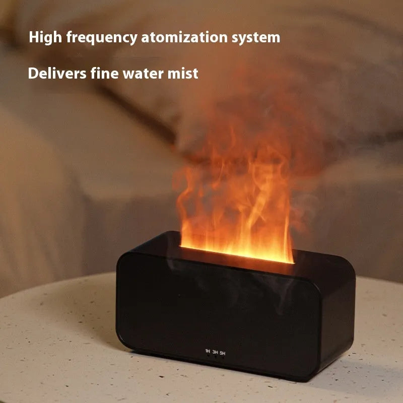 White USB aroma diffuser with glowing flame simulation and mist output on a wooden table.