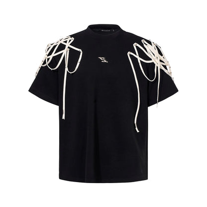 Black loose fit short sleeve T-shirt with rivet ribbon padded shoulder detail and round neck