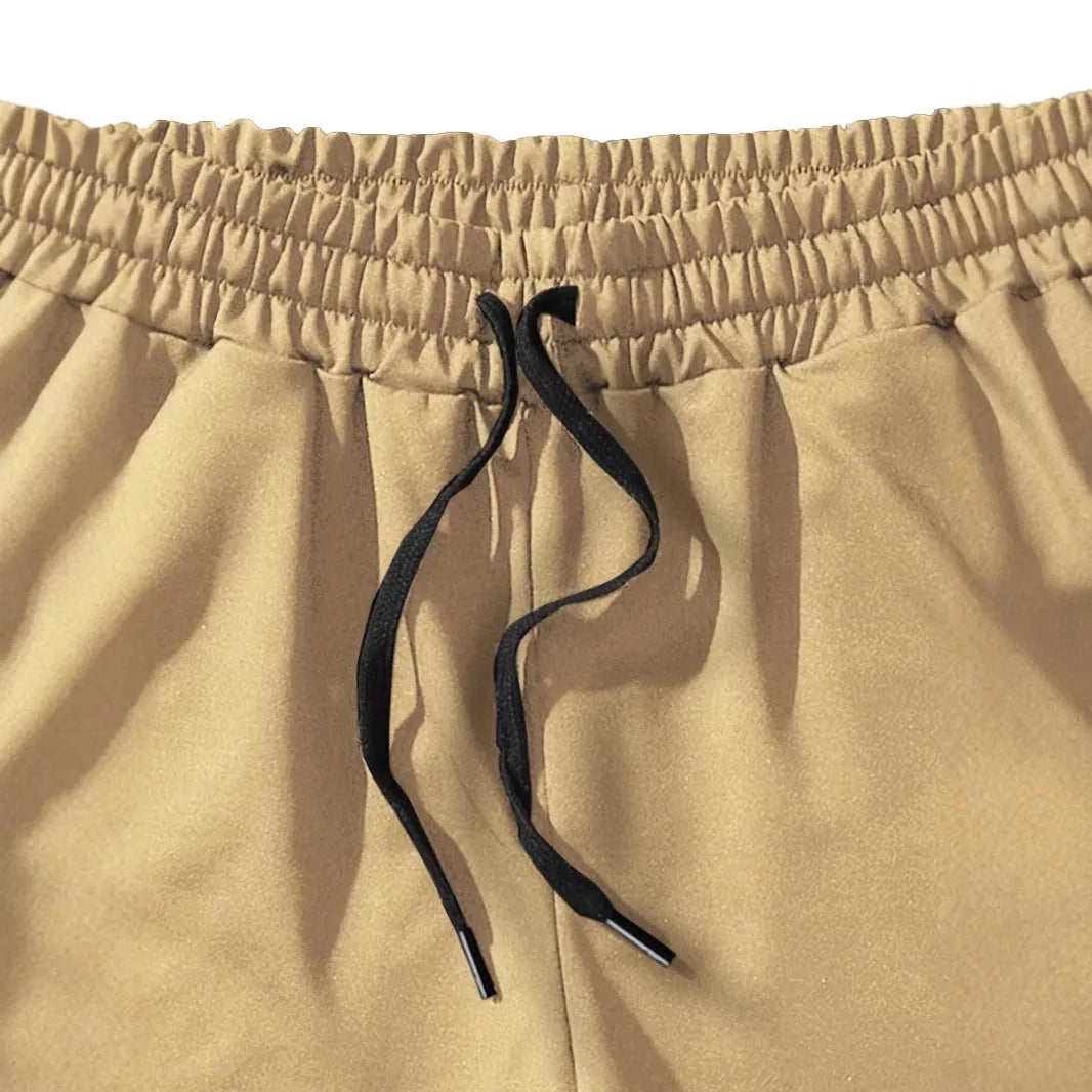 Men's khaki coconut print sports shorts with straight leg and elasticated waistband