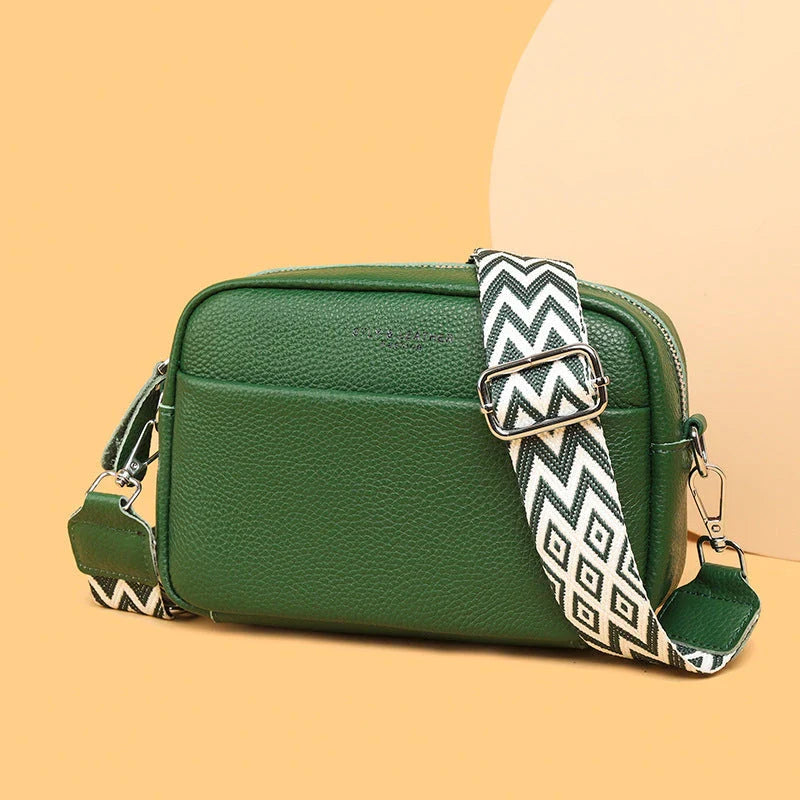 Stylish crossbody bag with rhombus embroidery, wide adjustable shoulder strap, and multiple interior pockets in various color options