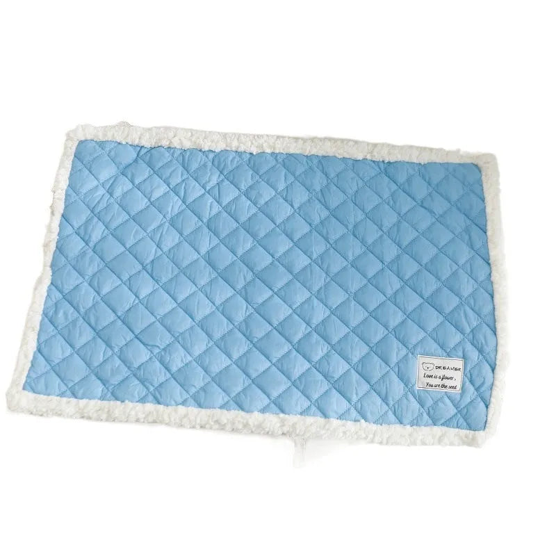 Blue quilted terry cloth pet blanket for cats shown in a cage, with size options M, L, and XL available.