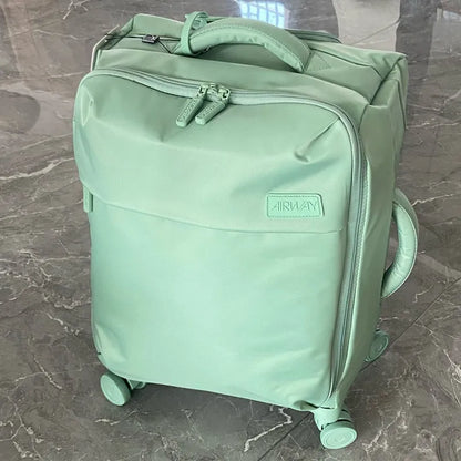 Ultra-light waterproof Oxford cloth suitcase in bluestone green with universal wheels showing 20-inch size dimensions