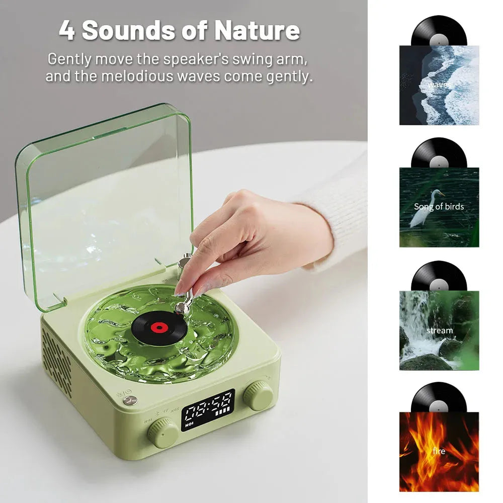 Retro-style turntable Bluetooth speaker with glowing RGB light projection on a wooden surface.
