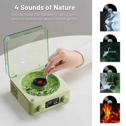 Retro-style turntable Bluetooth speaker with glowing RGB light projection on a wooden surface.