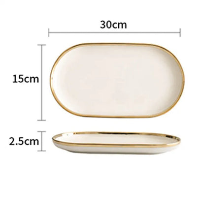 Platinum-coloured porcelain bowl and plate with gold rim, part of a wedding gift tableware set.