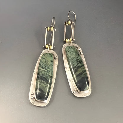 Two-tone geometric marble pattern alloy earrings with butterfly clasp, showing front and side views
