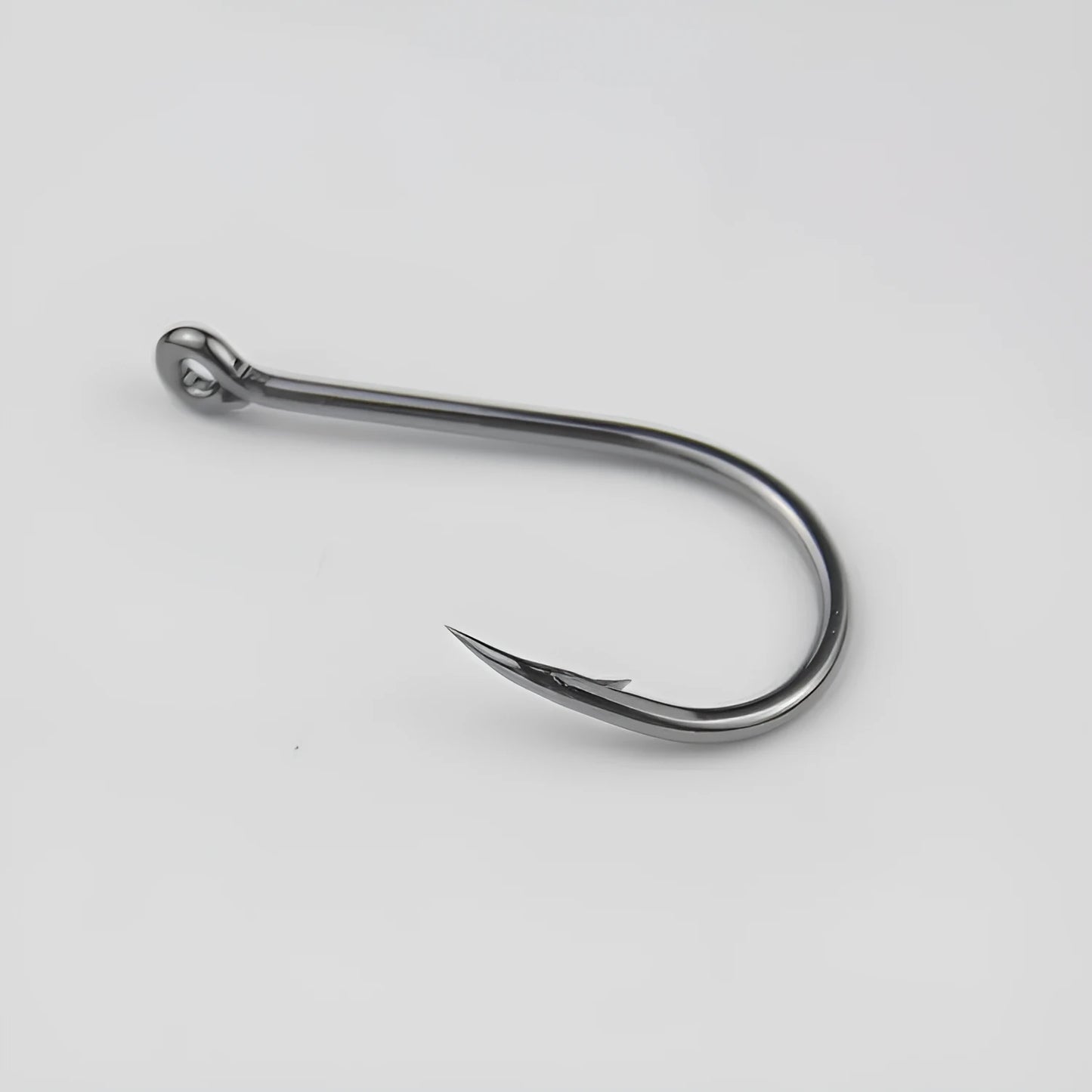 Bulk pack of barbed fishing hooks in various sizes on a blue background, showing crooked mouth and hole ring design.