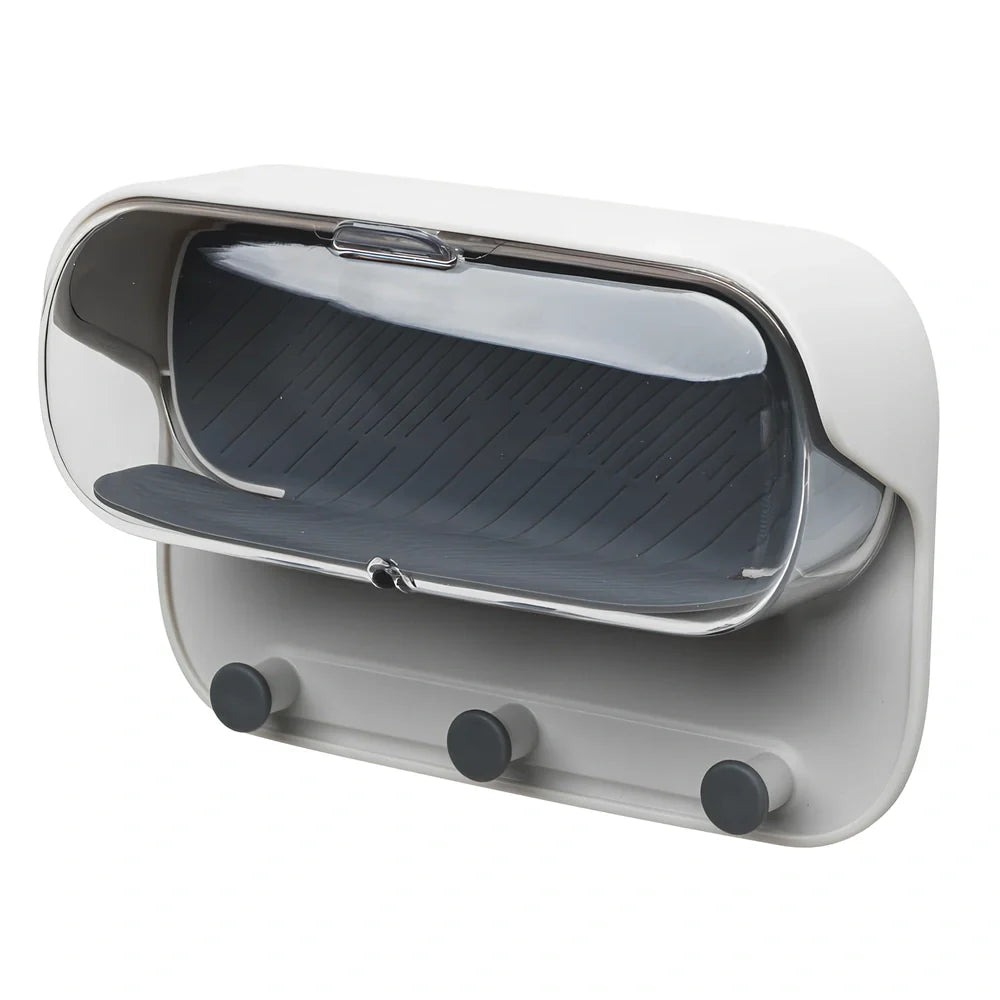 Grey punch-free bathroom storage box mounted on wall with transparent lid showing glasses inside