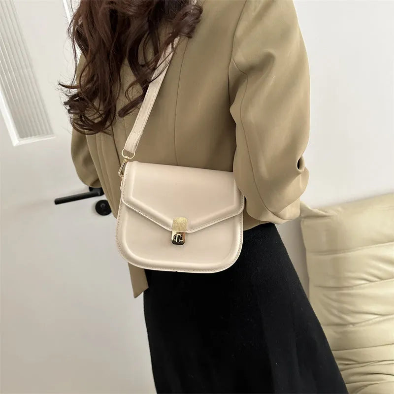 Soft PU leather messenger bag with textured finish in horizontal rectangular shape