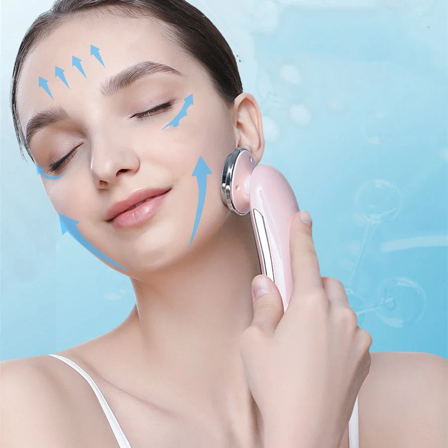 Pink and white facial massager with light therapy and pore cleansing features